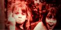 BitchPHd Bitch, PhD header image. Two little girls, possibly from the seventies, are looking into the camera. One laughing, one flipping the bird.