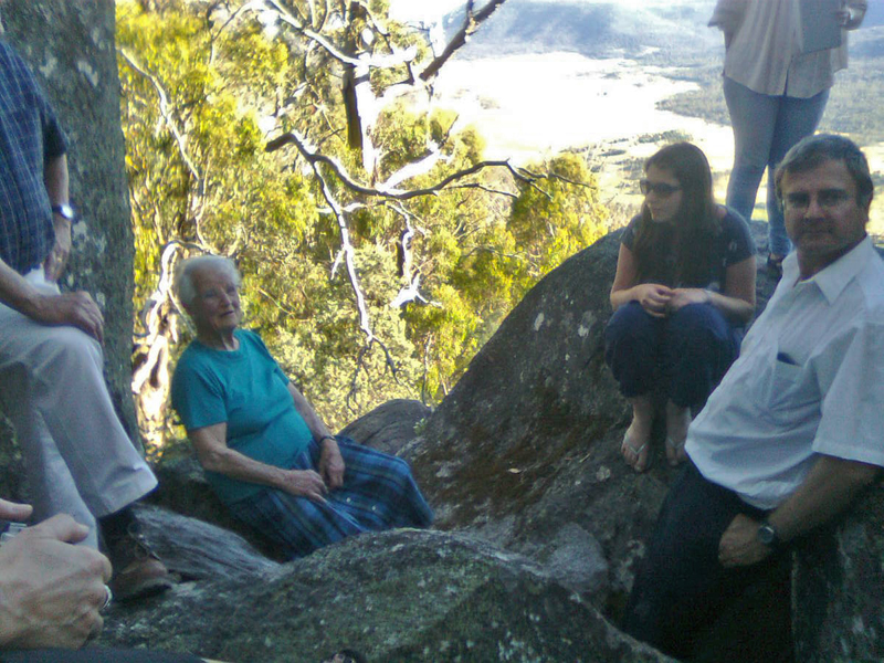 Lizzie sitting on a granite tor looking down on Orroral valley - scattering Dad's ashes